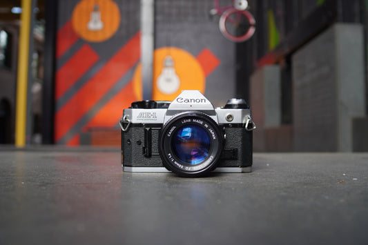 Canon AE-1 Program SLR Camera with Canon FD 50mm f/1.4 Lens – 1414247